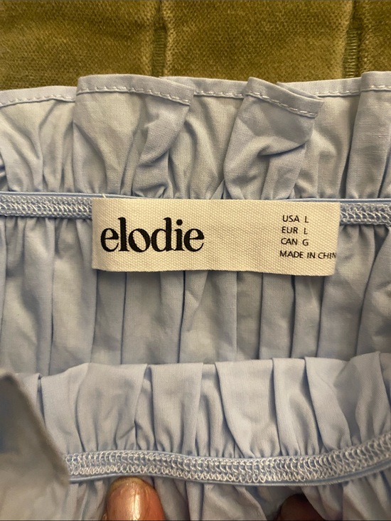 Elodie Light Blue Smocked Peplum Top with Flutter Sleeves